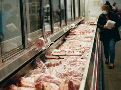 a line of meat in a grocery store