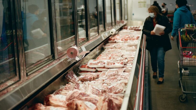 a line of meat in a grocery store