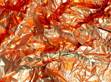 brown dried leaves on red textile