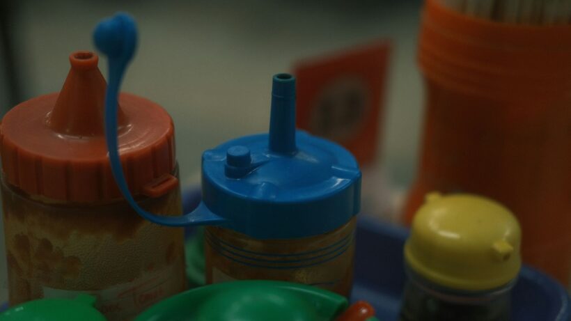 A close up of a baby bottle with a baby bottle next to it